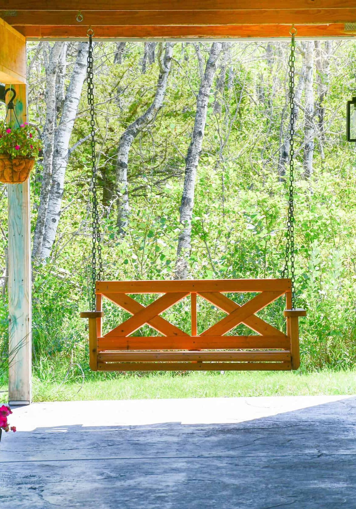Two chairs on a dock overlooking a pond